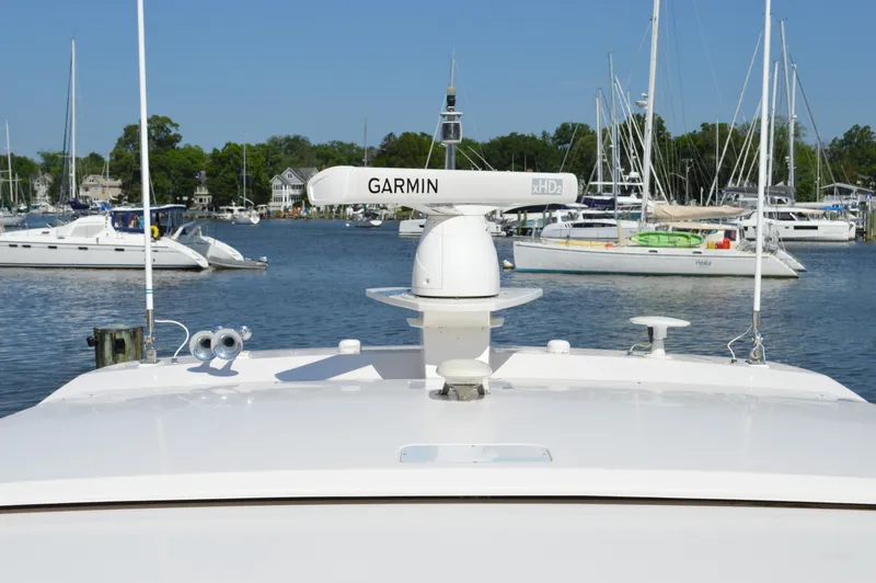 Slide: The Image of 2016 Tiara Yachts C44 Coupe with Garmin radar in a marina setting. - 26