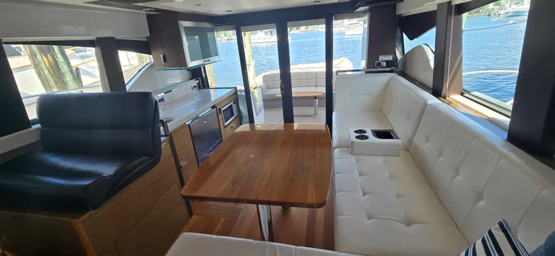 Slide: The Image of Luxurious interior of 2016 Tiara Yachts C44 Coupe with elegant seating and scenic water view. - 36