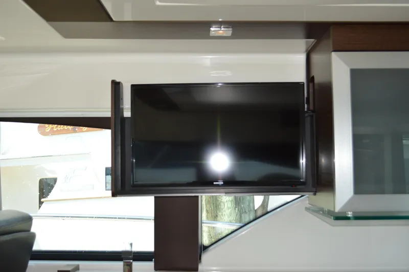 Slide: The Image of Flat-screen TV inside 2016 Tiara Yachts C44 Coupe interior. - 37