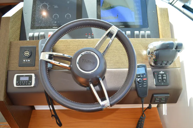 Slide: The Image of Steering wheel and controls of 2016 Tiara Yachts C44 Coupe. - 49