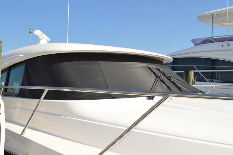Slide: The Image of 2016 Tiara Yachts C44 Coupe with sleek design and tinted windows. - 6