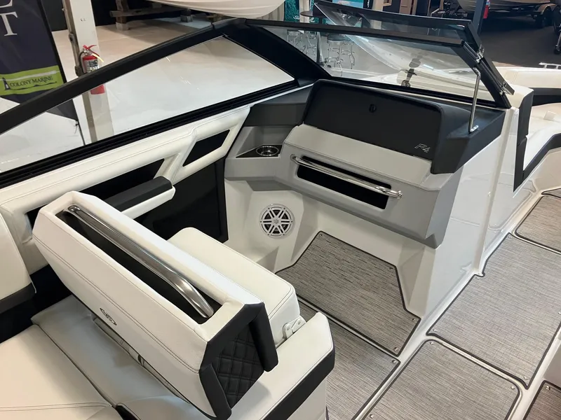 Slide: The Image of Interior of 2025 Cobalt R4 Outboard boat with modern seating and sleek dashboard design. - 10