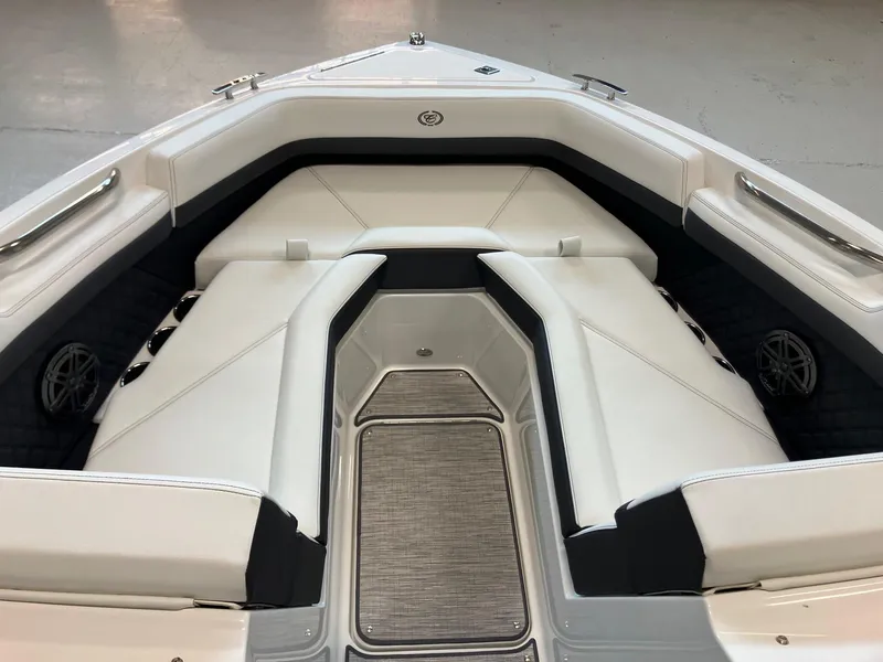 Slide: The Image of 2025 Cobalt R4 Outboard boat interior with white cushioned seating and sleek design. - 12