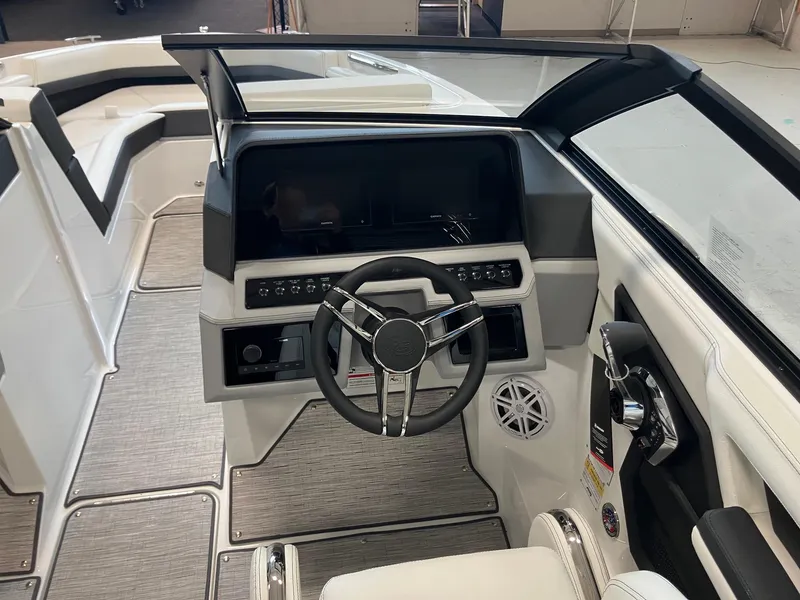 Slide: The Image of 2025 Cobalt R4 Outboard boat cockpit with modern steering and controls. - 9