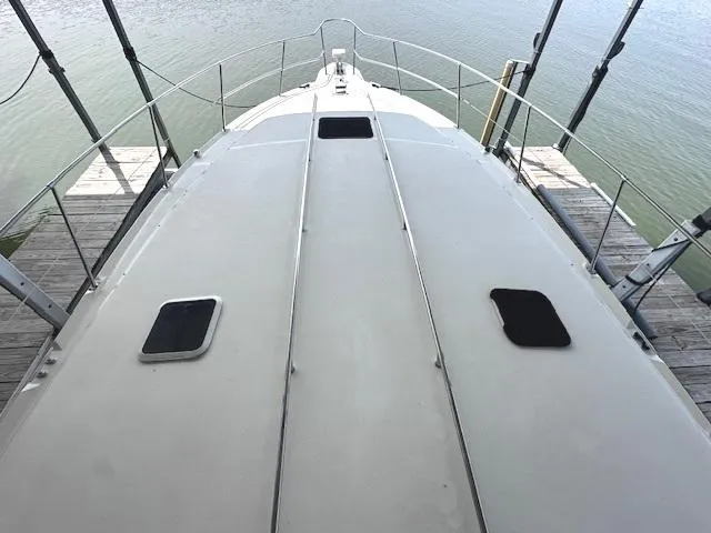 Slide: The Image of 1995 Sea Ray 400 Express Cruiser boat deck view at dock. - 10