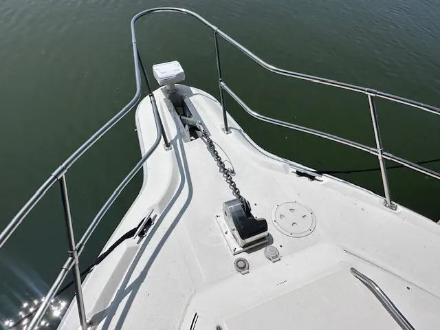 Slide: The Image of Bow of a 1995 Sea Ray 400 Express Cruiser with anchor chain and railing. - 11