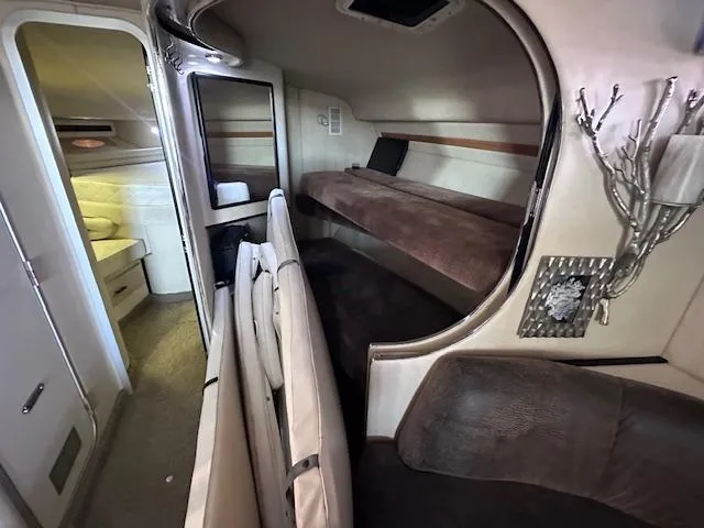 Slide: The Image of 1995 Sea Ray 400 Express Cruiser interior with bunk beds and modern decor. - 20