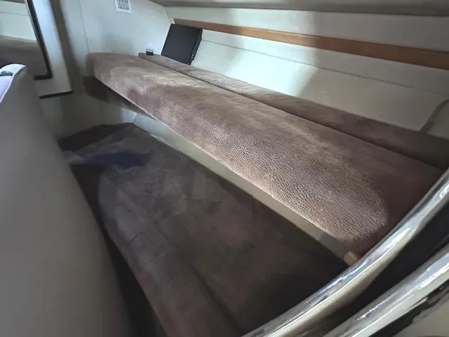 Slide: The Image of Interior cabin of 1995 Sea Ray 400 Express Cruiser with brown upholstery. - 21
