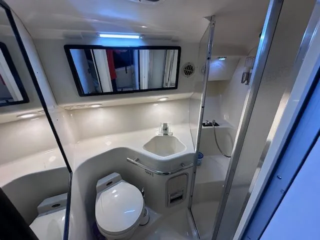 Slide: The Image of 1995 Sea Ray 400 Express Cruiser bathroom with modern fixtures and sleek design. - 26