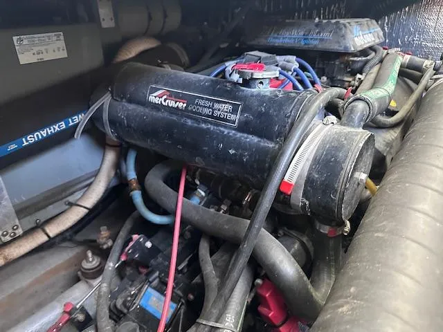 Slide: The Image of Engine compartment of a 1995 Sea Ray 400 Express Cruiser with MerCruiser cooling system. - 31