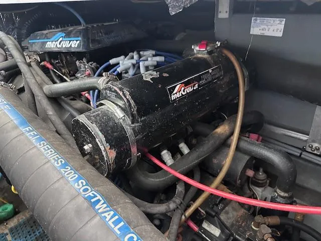 Slide: The Image of Engine compartment of a 1995 Sea Ray 400 Express Cruiser with MerCruiser components. - 32