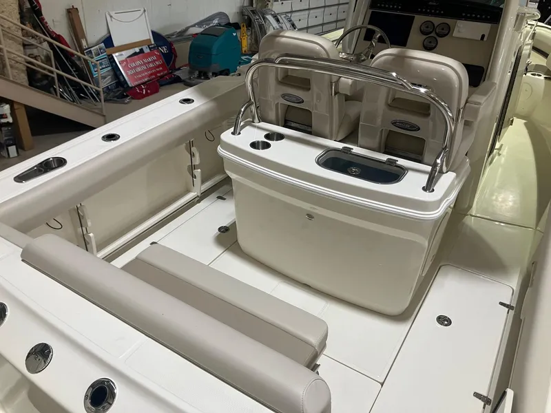 Slide: The Image of 2025 Boston Whaler 250 Outrage boat interior with seating and console. - 3