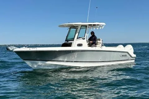 Slide: The Image of 2025 Boston Whaler 250 Outrage boat cruising on open water. - 36