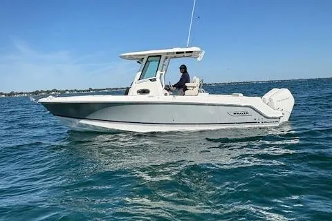 Slide: The Image of 2025 Boston Whaler 250 Outrage boat cruising on open water. - 37