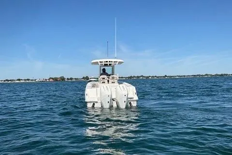 Slide: The Image of 2025 Boston Whaler 250 Outrage boat cruising on open water. - 39