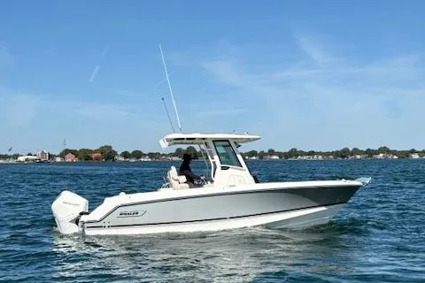 Slide: The Image of 2025 Boston Whaler 250 Outrage boat cruising on a sunny day. - 41