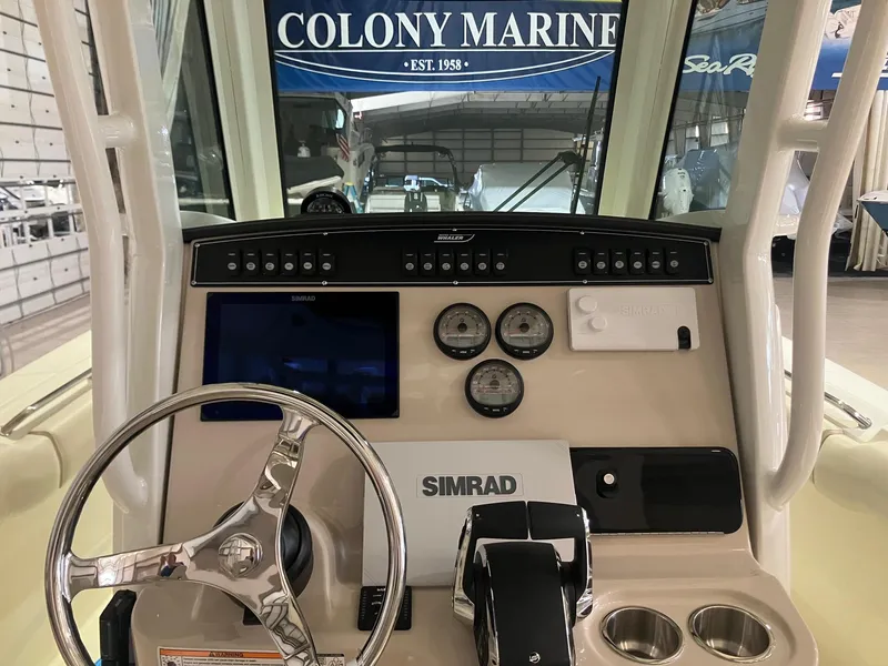 Slide: The Image of 2025 Boston Whaler 250 Outrage dashboard with Simrad electronics at Colony Marine. - 6