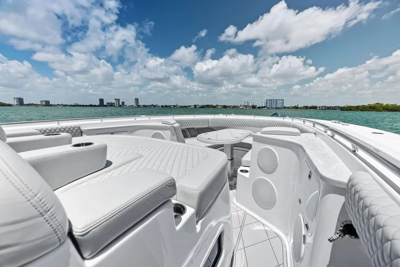Slide: The Image of Luxurious 2025 HCB 56' Sueños GIX yacht interior with plush seating and ocean view. - 16