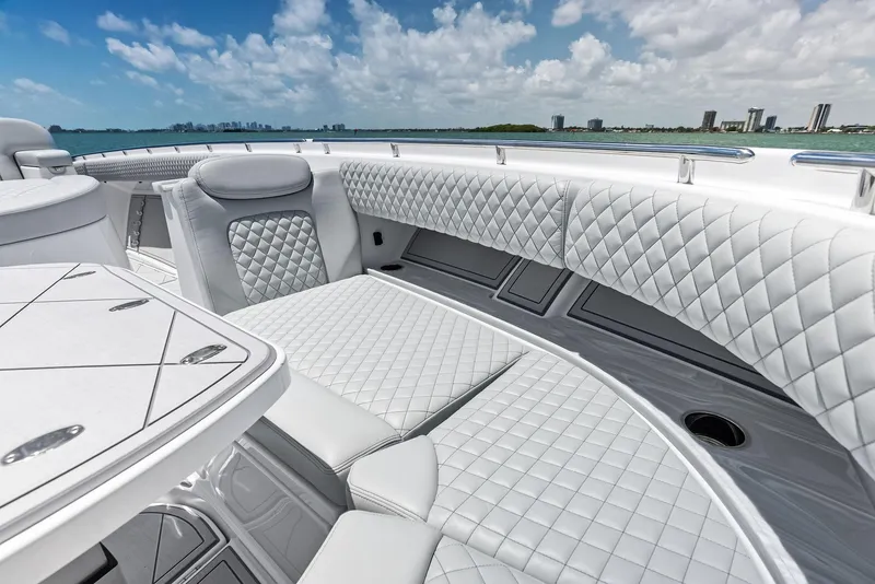 Slide: The Image of Luxurious interior of 2025 HCB 56' Sueños GIX yacht with quilted seating and ocean view. - 25