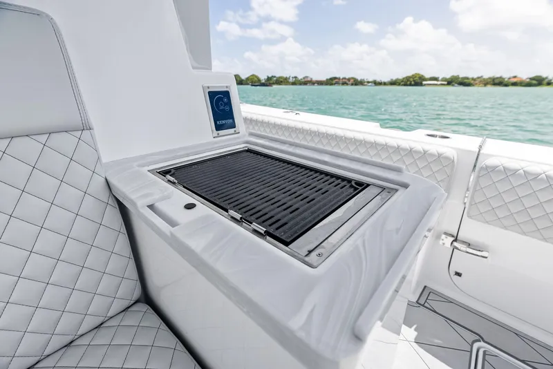 Slide: The Image of Luxury grill on 2025 HCB 56' Sueños GIX yacht, featuring sleek design and ocean backdrop. - 30