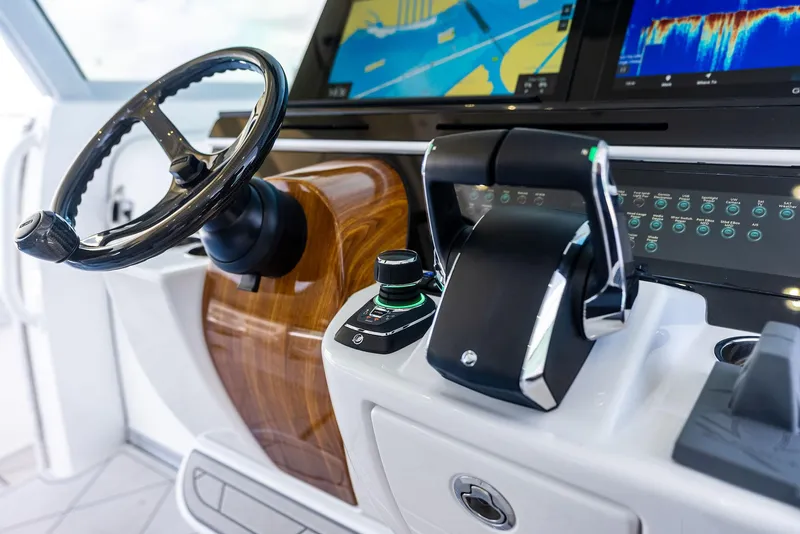 Slide: The Image of Helm of 2025 HCB 56' Sueños GIX with advanced navigation controls and displays. - 37