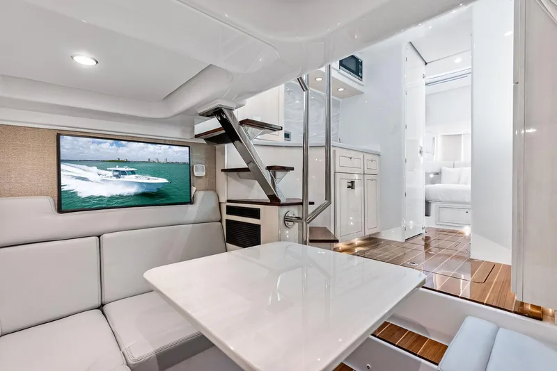 Slide: The Image of Luxurious interior of 2025 HCB 56' Sueños GIX yacht with modern seating and TV. - 43
