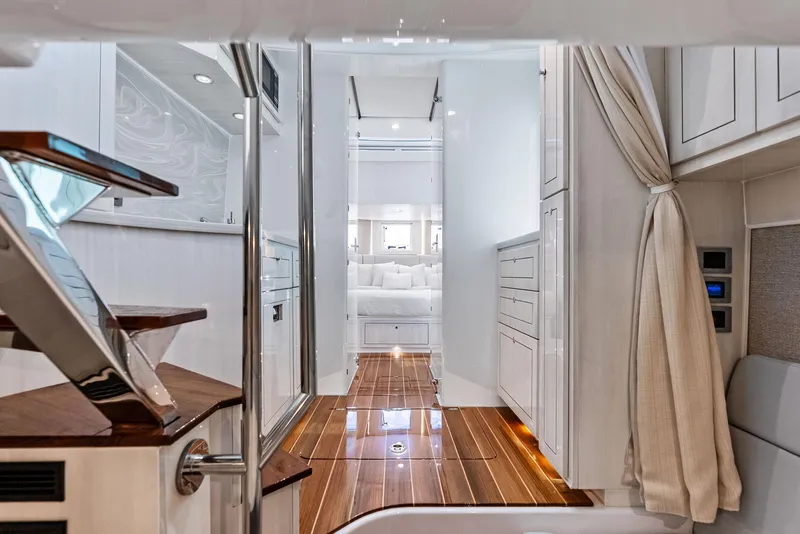 Slide: The Image of Luxurious interior of 2025 HCB 56' Sueños GIX yacht with elegant wood flooring. - 44