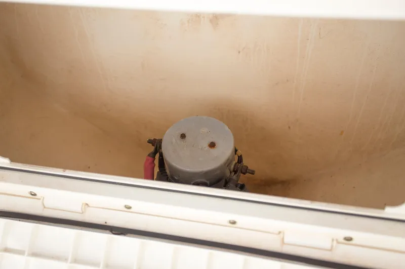 Slide: The Image of Storage compartment in a 2012 Contender 39 LS boat. - 21