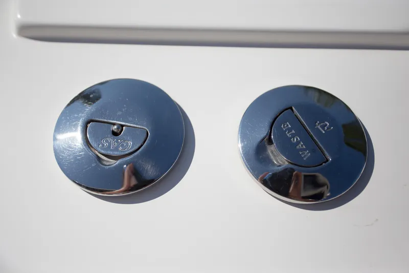 Slide: The Image of Chrome fuel and water caps on a 2012 Contender 39 LS boat. - 28