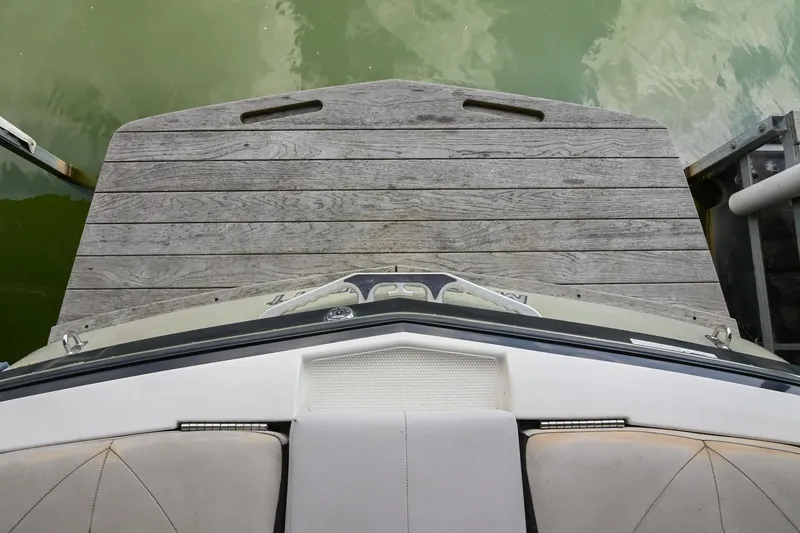 Slide: The Image of 2009 MasterCraft X-45 boat docked on wooden pier, viewed from above. - 10