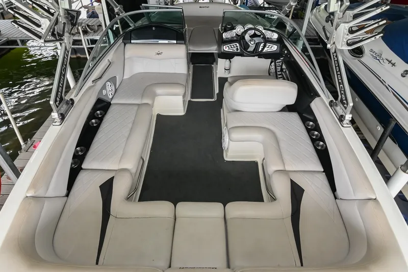 Slide: The Image of 2009 MasterCraft X-45 boat interior with spacious seating and modern dashboard. - 15