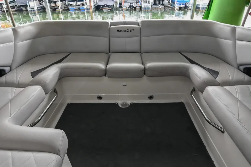 Slide: The Image of 2009 MasterCraft X-45 boat interior with gray seating and sleek design. - 17