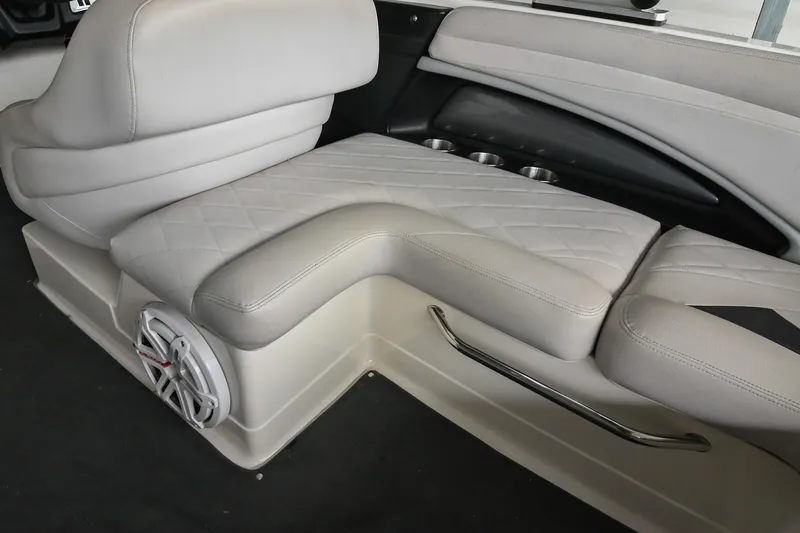 Slide: The Image of 2009 MasterCraft X-45 boat interior with gray seating and speaker. - 18