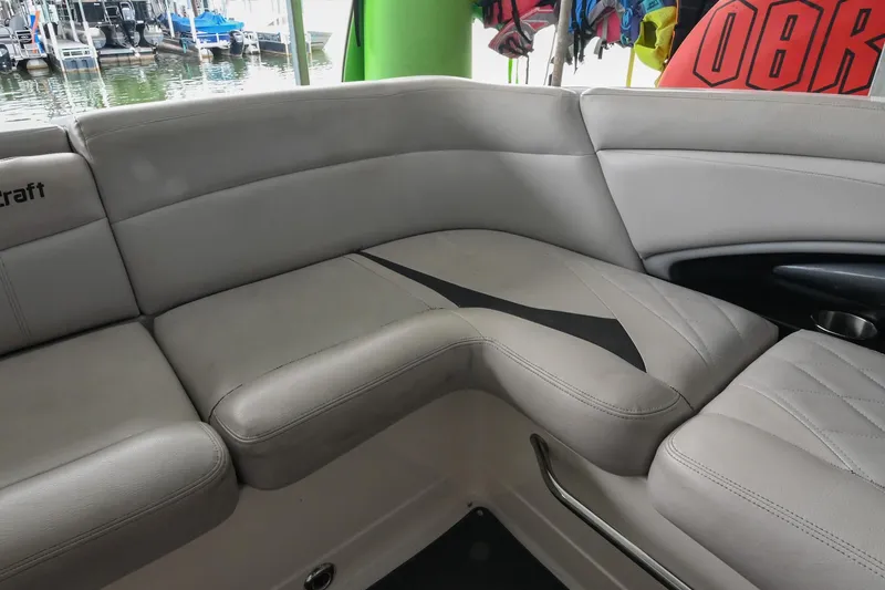 Slide: The Image of 2009 MasterCraft X-45 boat interior with gray seating and lake view. - 20