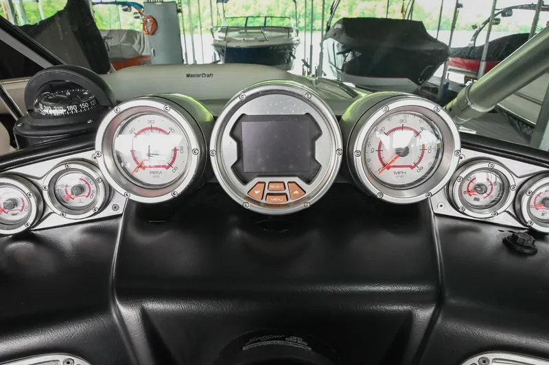 Slide: The Image of Dashboard of 2009 MasterCraft X-45 boat with gauges and controls. - 30