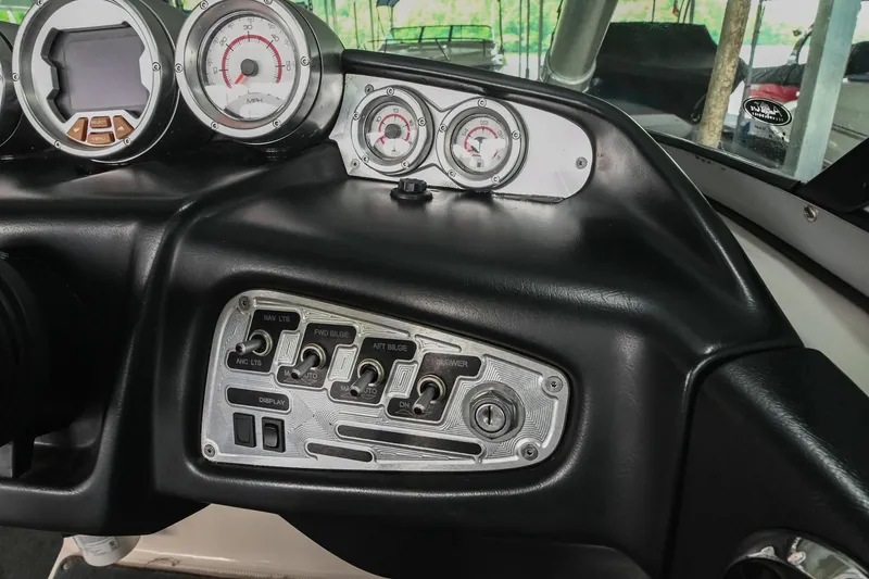 Slide: The Image of Dashboard of a 2009 MasterCraft X-45 boat with gauges and control panel. - 31