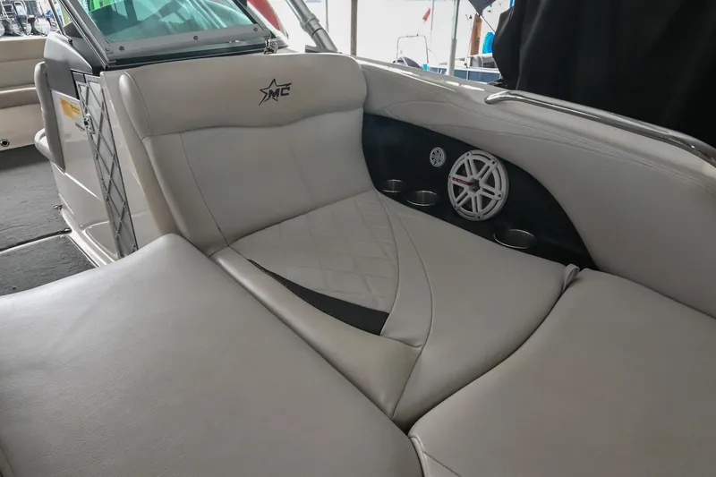 Slide: The Image of 2009 MasterCraft X-45 boat interior with cushioned seating and speaker detail. - 37