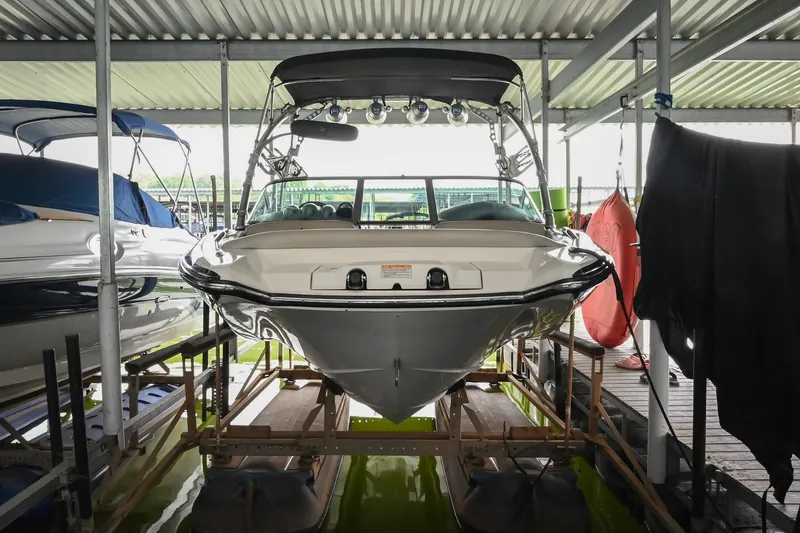 Slide: The Image of 2009 MasterCraft X-45 boat docked in covered marina, front view. - 5