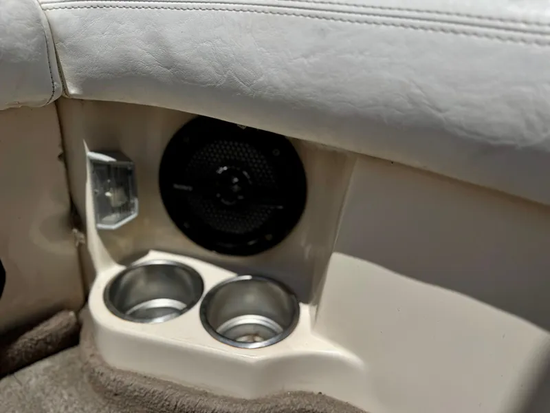 Slide: The Image of 2005 Tigé 24V boat interior with speaker and cup holders. - 11