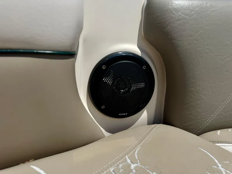 Slide: The Image of Sony speaker installed in a 2005 Tigé 24V boat's beige interior. - 7