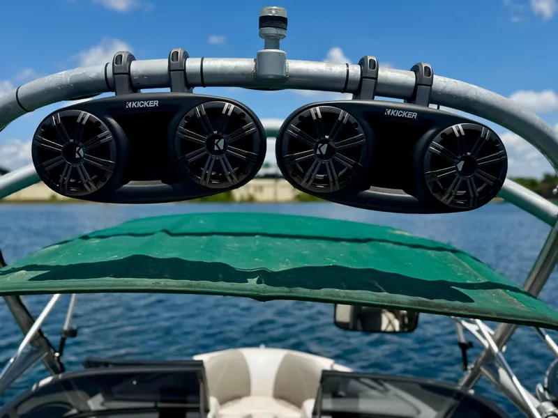 Slide: The Image of 2005 Tigé 24V boat with Kicker speakers on a sunny day. - 9