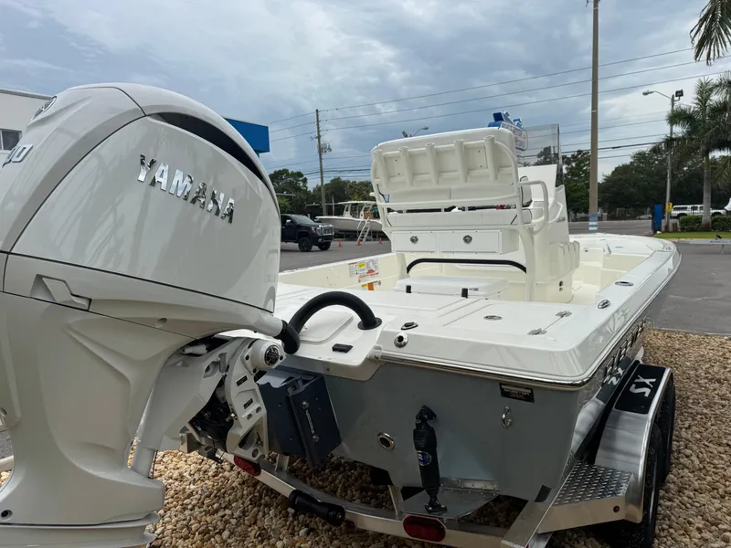 Slide: The Image of 2025 Skeeter SX 221 boat with Yamaha engine, parked on a trailer. - 13