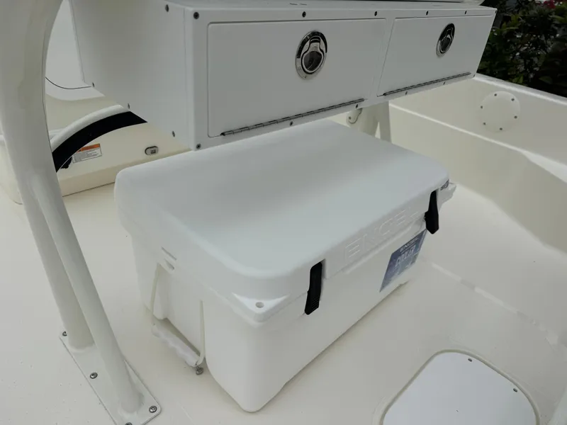 Slide: The Image of 2025 Skeeter SX 221 boat interior with storage compartments and cooler. - 23