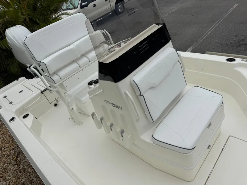 Slide: The Image of 2025 Skeeter SX 221 boat interior with white seating and console. - 33