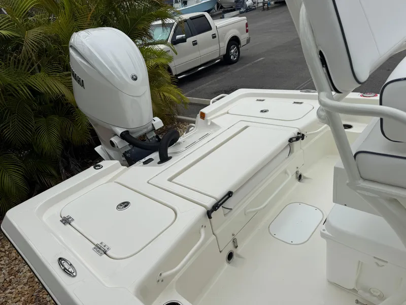 Slide: The Image of 2025 Skeeter SX 221 boat with Yamaha outboard motor, parked near a truck. - 37