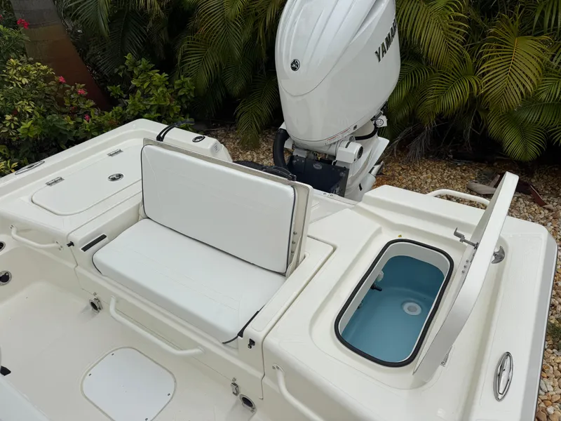 Slide: The Image of 2025 Skeeter SX 221 boat with Yamaha engine, featuring seating and storage compartments. - 38