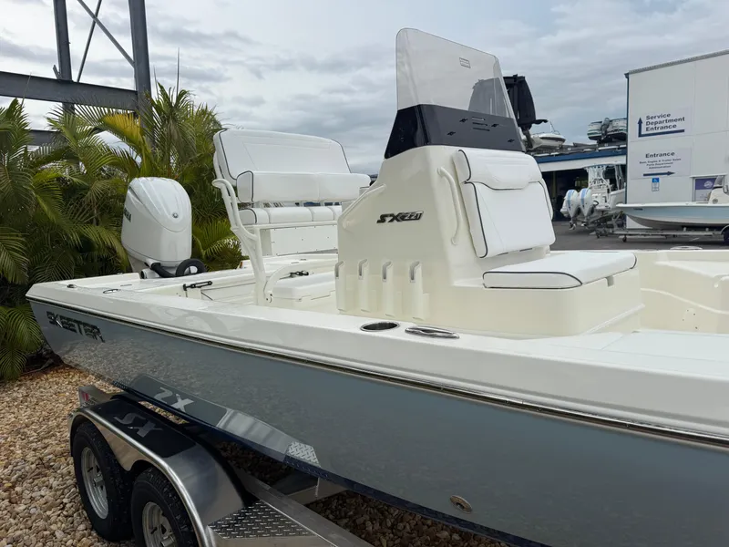 Slide: The Image of 2025 Skeeter SX 221 boat on trailer, featuring sleek design and modern seating. - 8