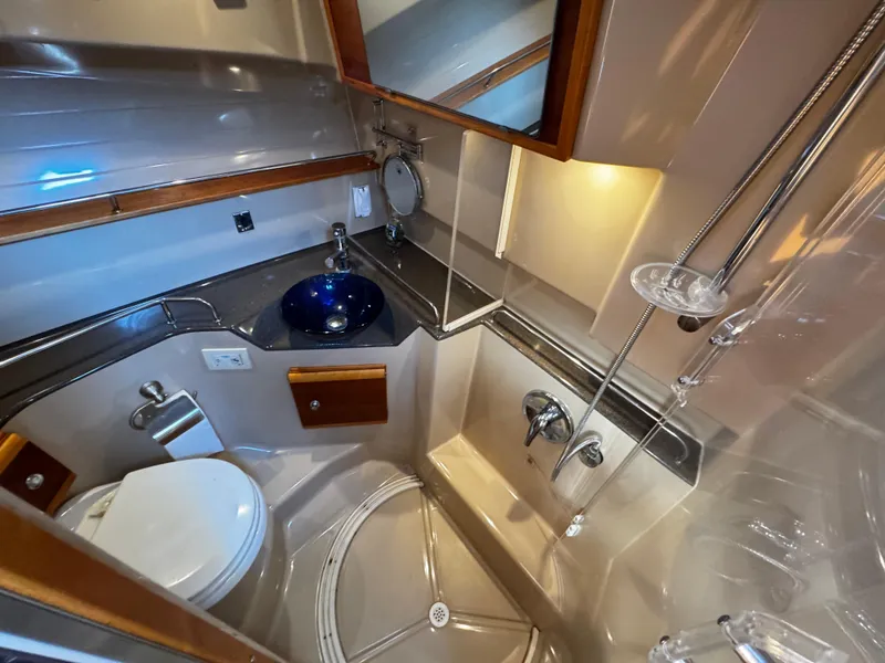 Slide: The Image of Luxurious bathroom in 2014 Cutwater 30 Sedan LE yacht with modern fixtures and elegant design. - 20