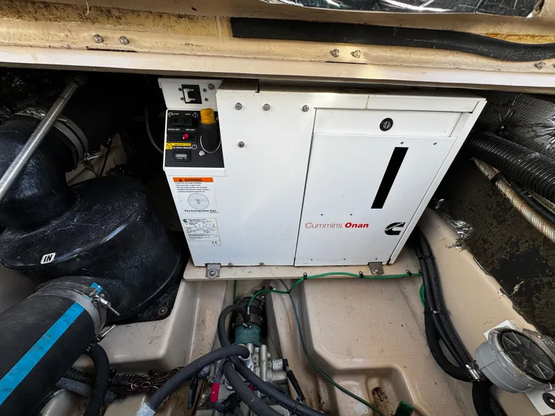 Slide: The Image of Cummins Onan generator in 2014 Cutwater 30 Sedan LE engine compartment. - 23