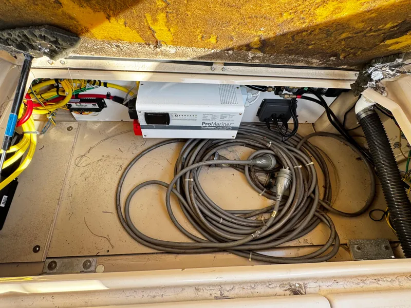 Slide: The Image of Electrical compartment of a 2014 Cutwater 30 Sedan LE with cables and equipment. - 24
